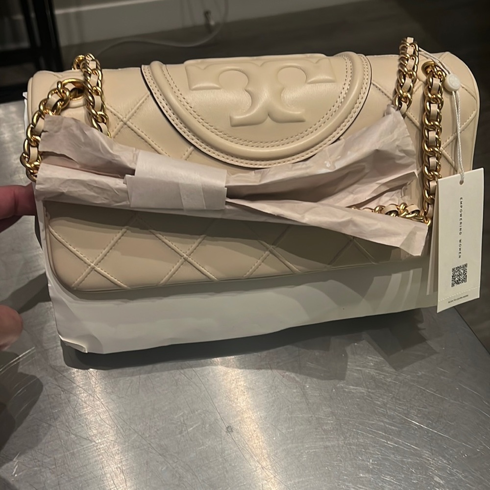 Fleming shoulder bag is crafted of lambskin leather. $698 retail!